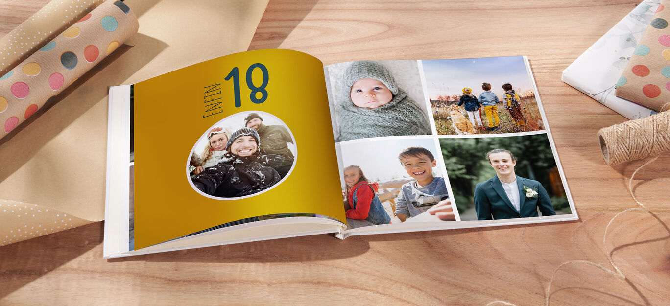 Un album photo ouvert avec une couverture colorée et d'excellentes photos souvenirs.